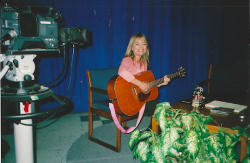 Michelle Chappel playing guitar with movie camera